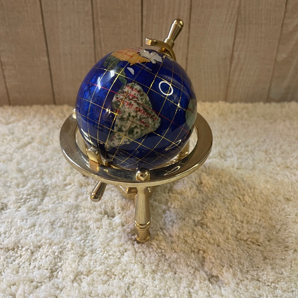 Atlas Made With Precious Stones On A Brass…